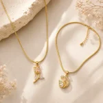 Pendant Necklace Combo for Women featuring Anti Tarnish Swan and Tulip Gold Tone Necklaces