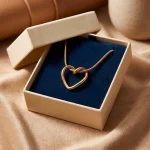 Side View of Heart Pendant Necklace in Gold Tone Finish
